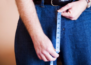 a man holding a measuring tape