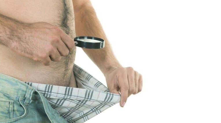 a man looks at his underwear and thinks about penis enlargement with soda